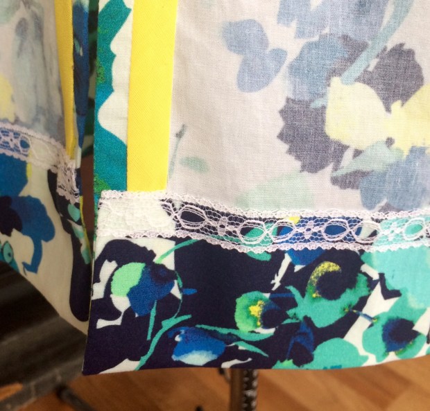 I had to improvise a bit on the inside along the slits since I was unhappy with the pattern design. I chose to use bright yellow bias tape to conceal the overlooked (aka: ugly) fabric edge. 